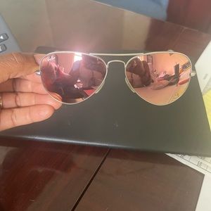 Silver toned, pinkish reflective Aviator glasses.
